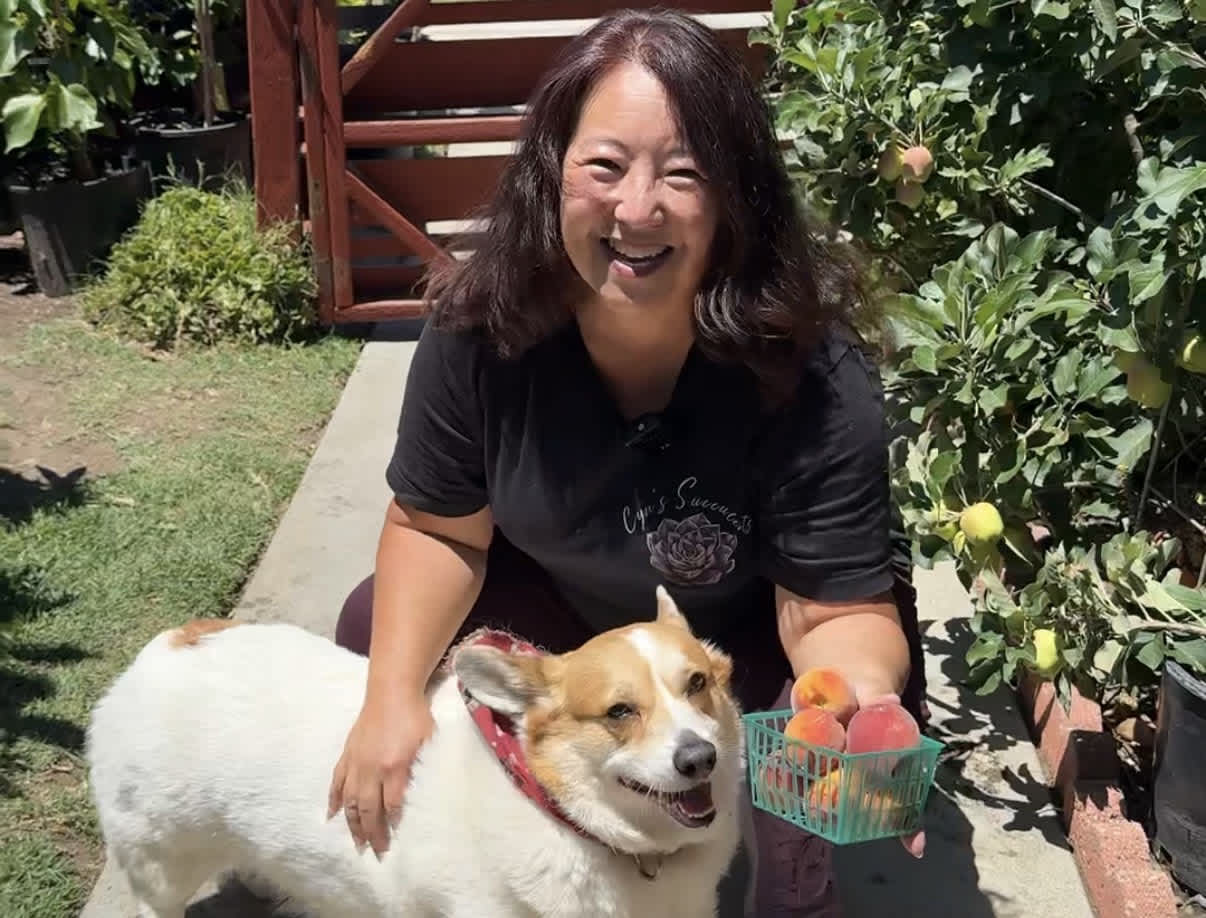 Cynthia, a featured PickFresh seller, with her backyard produce