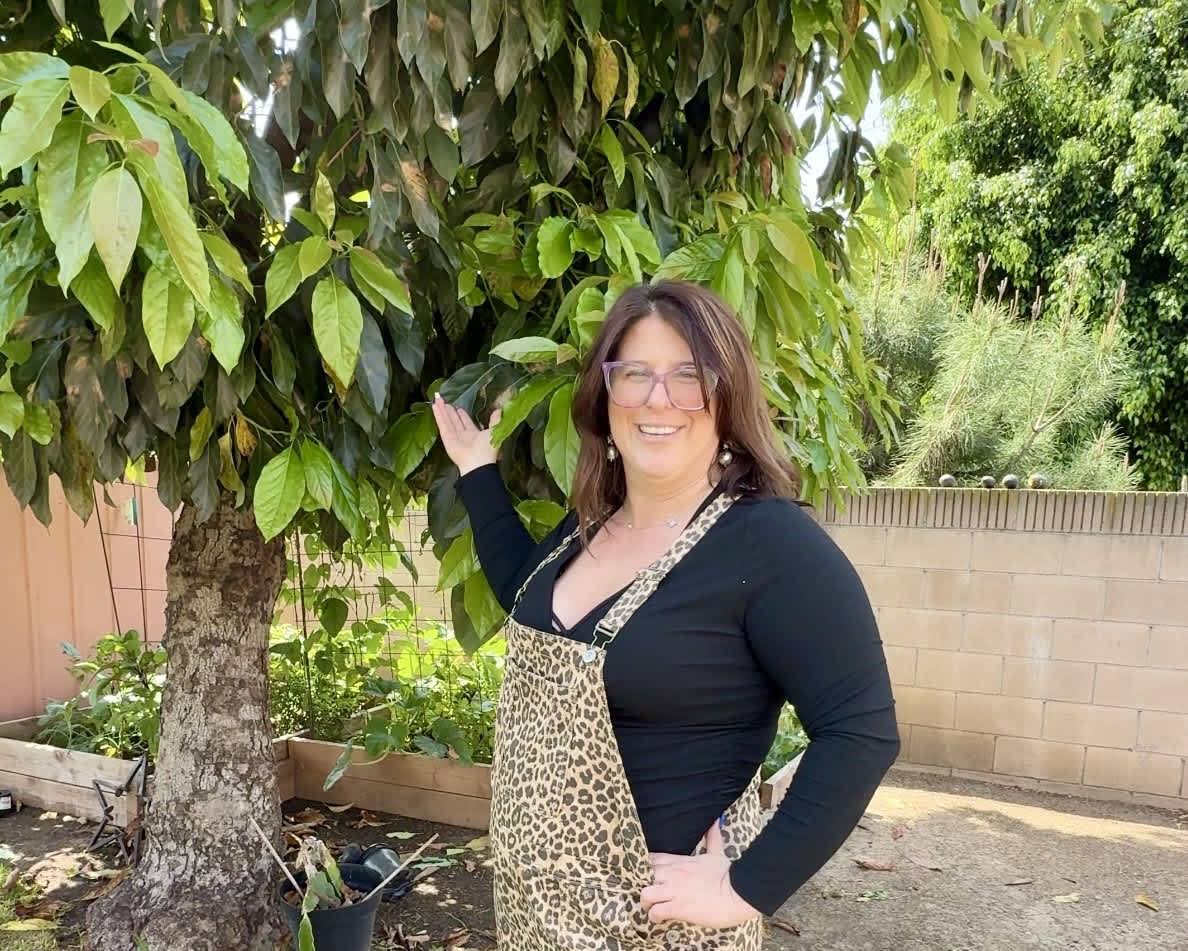 Kendelle, a featured PickFresh seller, with her homegrown avocados