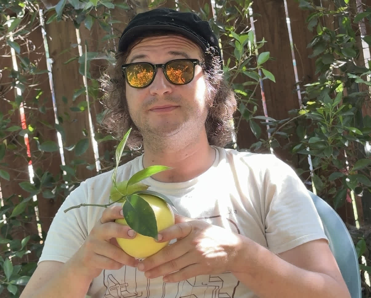 Neil, a featured PickFresh seller, in his backyard garden