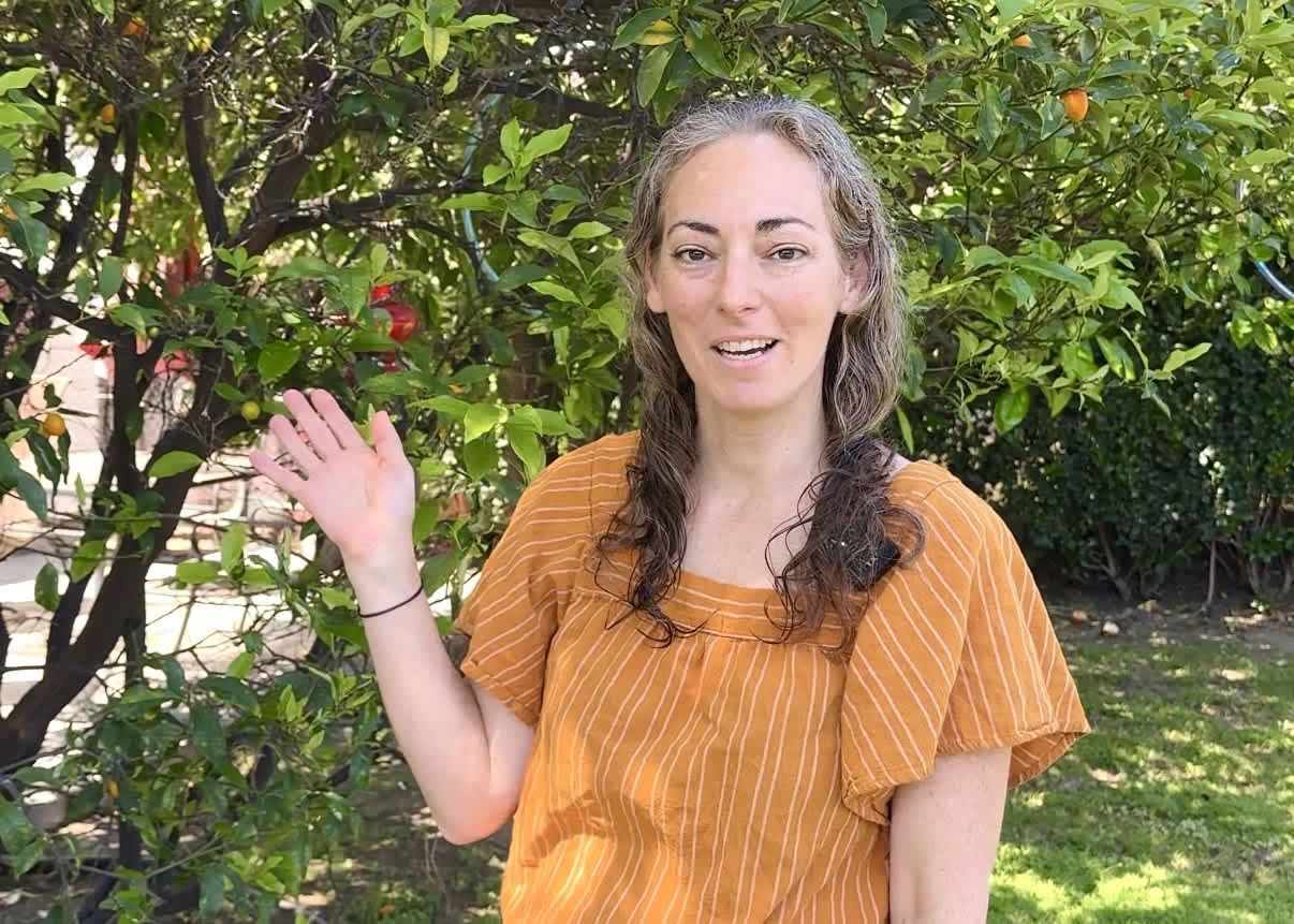 Yael, a featured PickFresh seller, with her citrus harvest